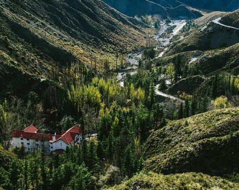 a house in the mountains with a red roof Villavicencio Mendoza Argentina