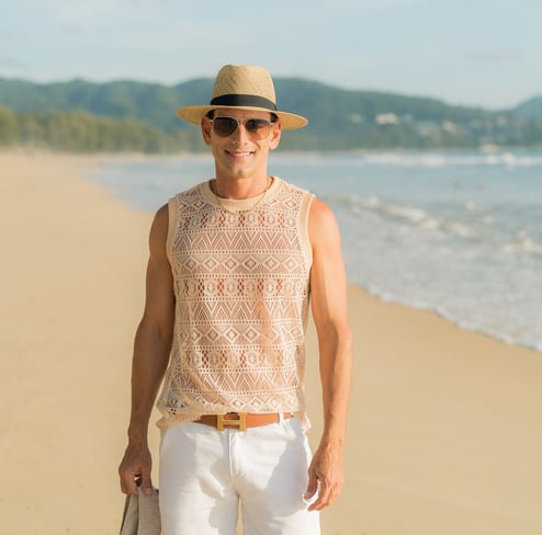 Rick Silvia wearing a sun hat on a beach in Thailand