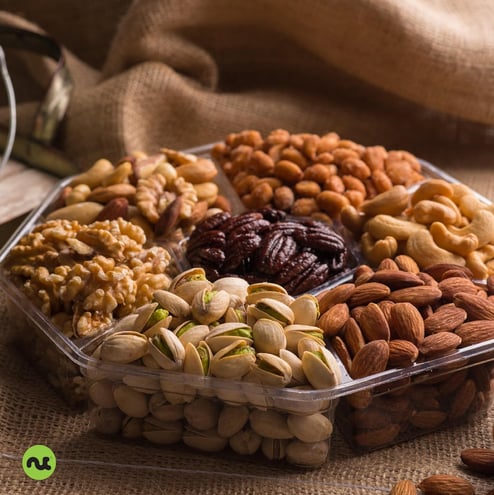 a variety of nuts and nuts in a plastic container