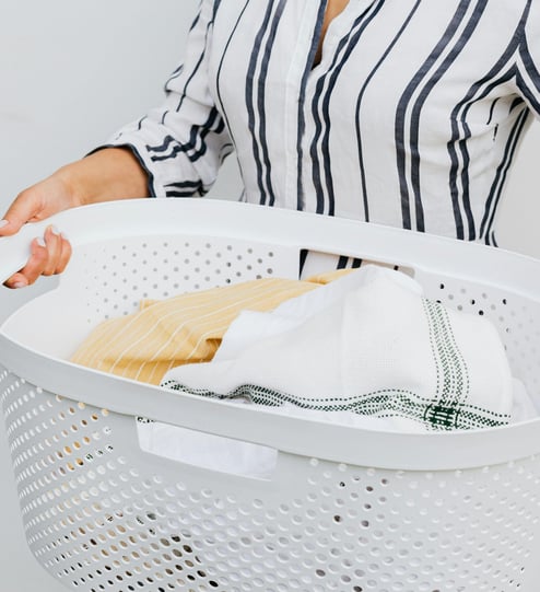 woman holding a laundry basket