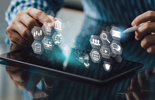 a man holding a tablet with icons and icons
