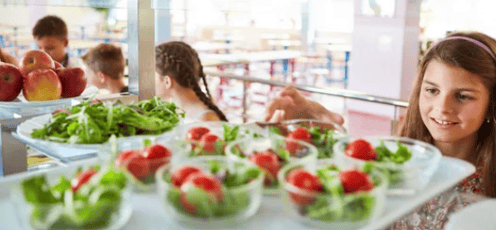 school children eating salads