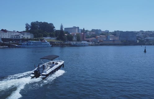 Private boat cruising on Douro River in Porto, Portugal, for scenic tours