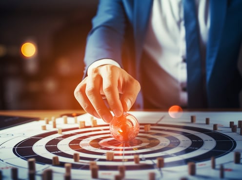 a person in a suit and tie is touching a button on a computer screen