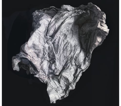 An abstarct photo of a sheet or membrane floating in a black space