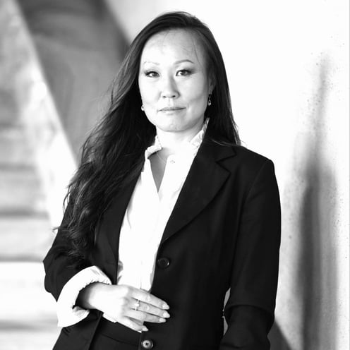 B&W pohto of Jiang with white blouse, black jacket. Photo: Magnus Aronson