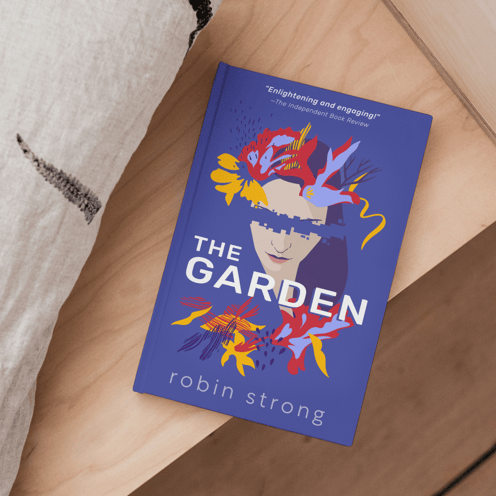 The Garden hardcover book on a desk