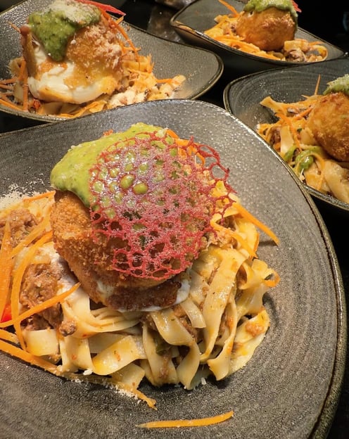 a plate of food with pasta and cheese