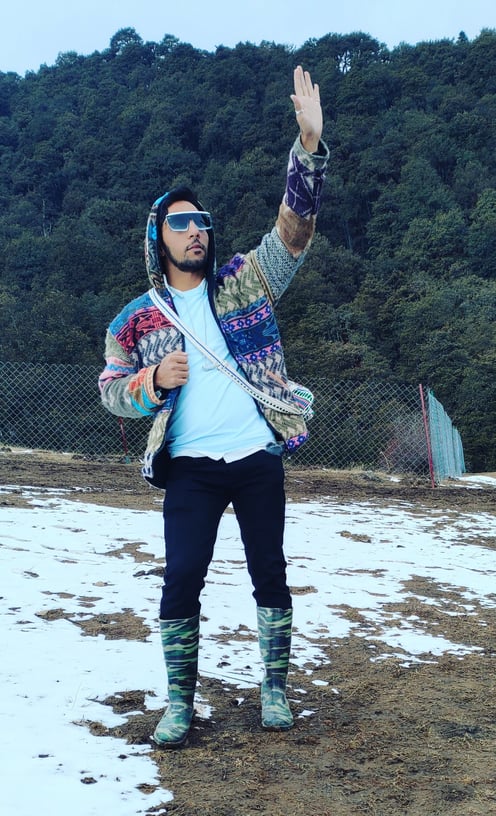 Huy Waving Hand at Ice Rock