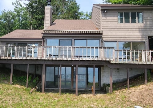 Before Picture with Old Doors and Deck