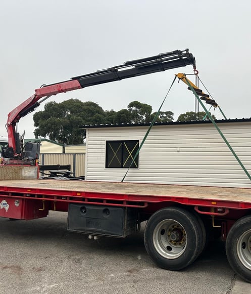 crane lifting potable house