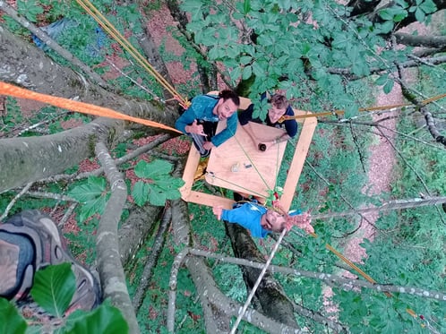 Hanging table with three smiling men