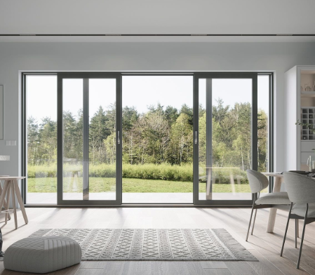a living room with a large window and a rug rug