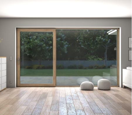 a room with a sliding glass door and a white dresser
