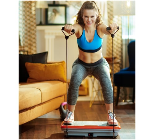 Woman using a vibration plate to help maximize her workout