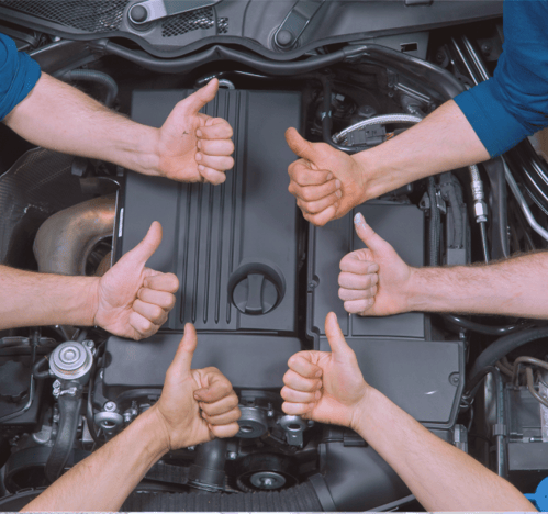 Professional auto repair team at AMI Service & Rental, ensuring quality service with a thumbs-up for