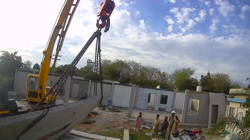 Crane lifting precast wall panels