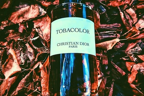 Dior Tobacolor bottle on tobacco leaves