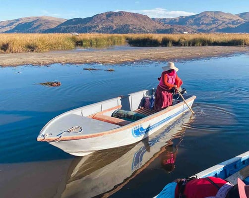 Peruvian woman on a boat on Lake Titicaca in Peru.