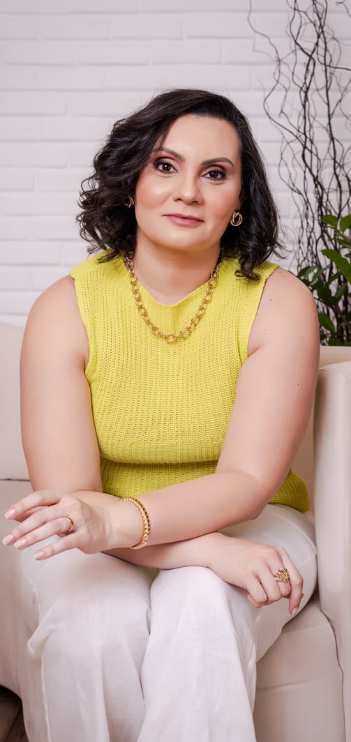 a woman sitting on a couch in a living room
