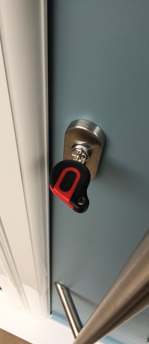 an ultion key on a new duck egg blue composite door