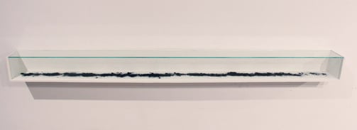 Jennifer Mae Wood, The Remains, Wood, glass, eraser shavings, 61x4x4", 2015