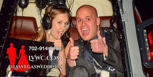wedding couple inside a helicopter thumbs up