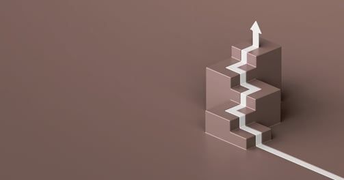 logo for the core coaching program with stairs and an arrow going up