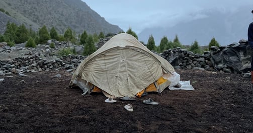 A white tent in the mountains