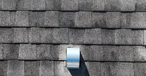 Close-up drone photo of a rooftop in Bartow, Florida, showing hurricane damage for insurance purpose
