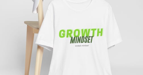 a white t - shirt with a green and black growth mindset