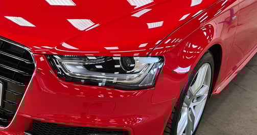 a red car parked in a garage