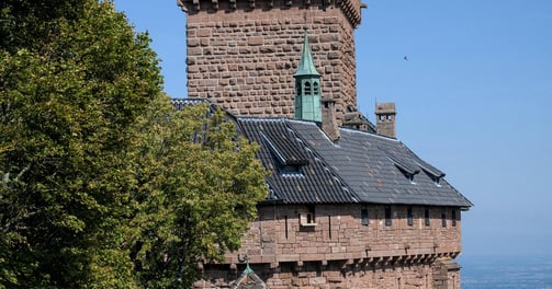 a large brick building with a clock tower