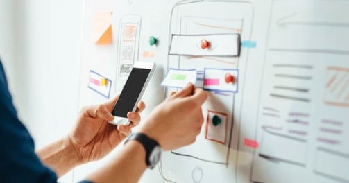 https://www.shutterstock.com/image-photo/web-designer-planning-application-mobile-phone-622216766