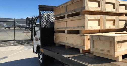 a truck with a load of pallets on it