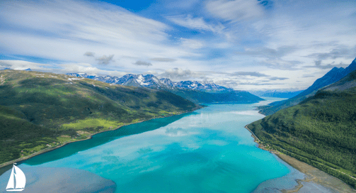 a view of a lake and mountains in the distance from Norwegian Fjords