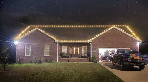 Frontal view of house decorated with lights