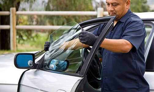 a man in a blue shirt is holding a bag of food