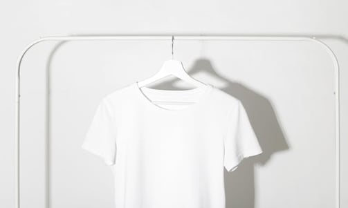 A white shirt on a hanger | fashion translation