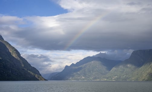 Sognefjord with clouds and rainbow Norway