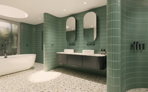 Organic minimalist en-suite: curved hunter green KitKat-tiled walls, freestanding tub, wet zones