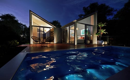 Woodland prefab guesthouse with timber interiors, large windows, outdoor pool, sustainable retreat