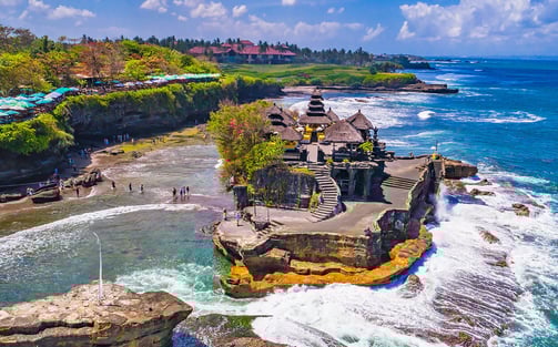 a beach with a view of a beach and a cliff