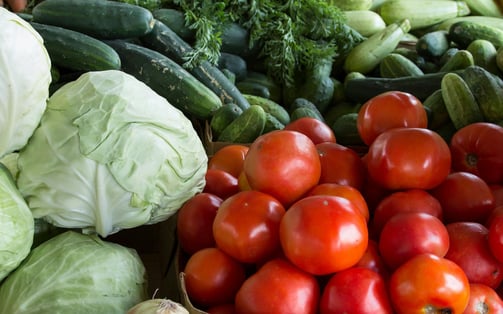 a variety of vegetables and fruits are displayed in a variety of baskets
