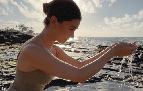 Woman holding healing water