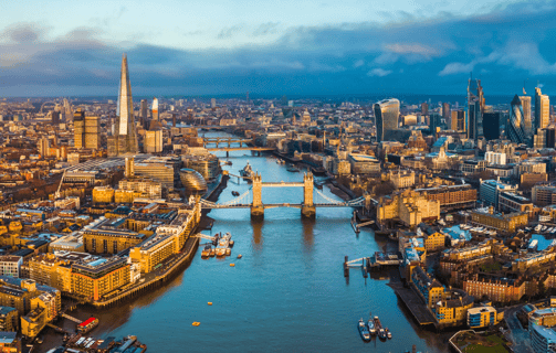 a cityscape of a river with a bridge in the foreground