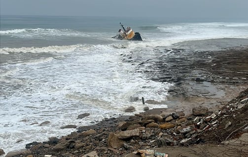 View of the shipwreck and waves