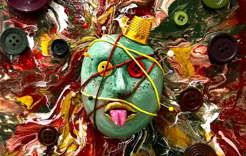 a painting of a face with buttons and buttons