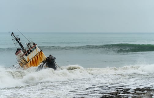 shipwreck with wave about to roll on the back