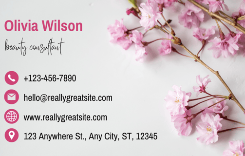a business card with a pink flower on it